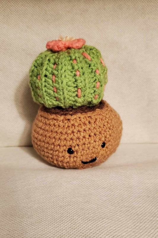 Cute handmade crochet cactus in a pot.