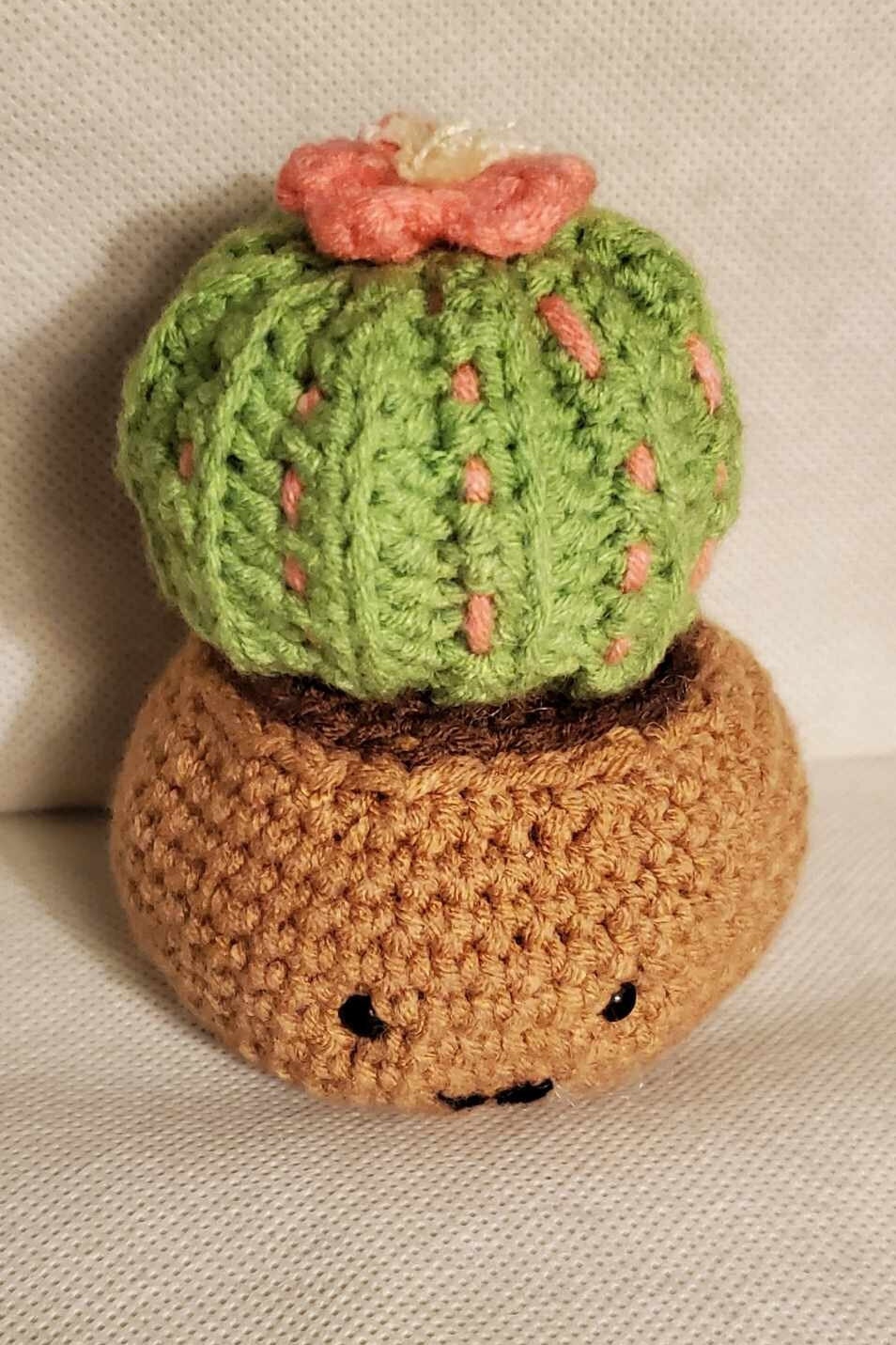 Cute handmade crochet cactus in a pot.