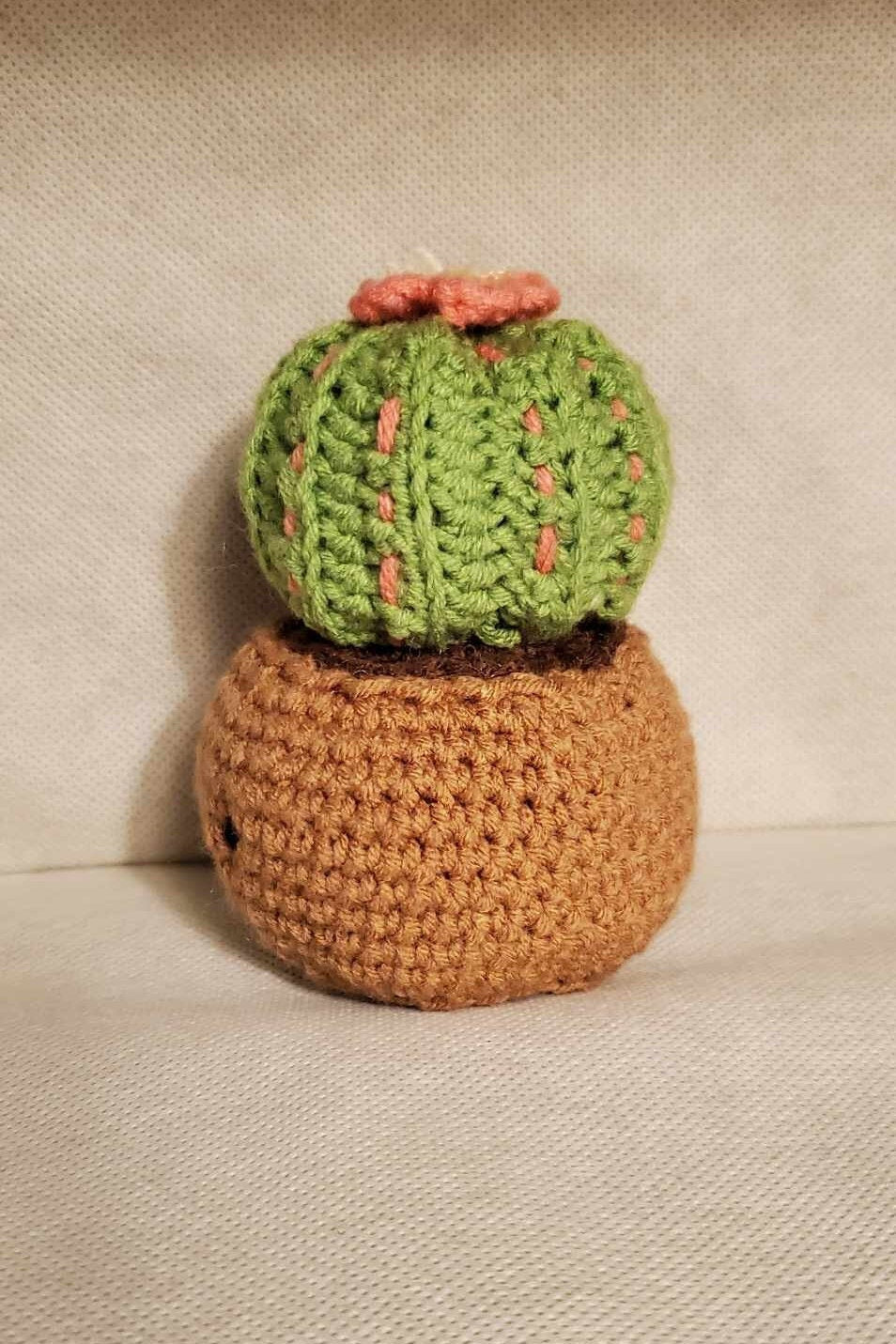 Cute handmade crochet cactus in a pot.