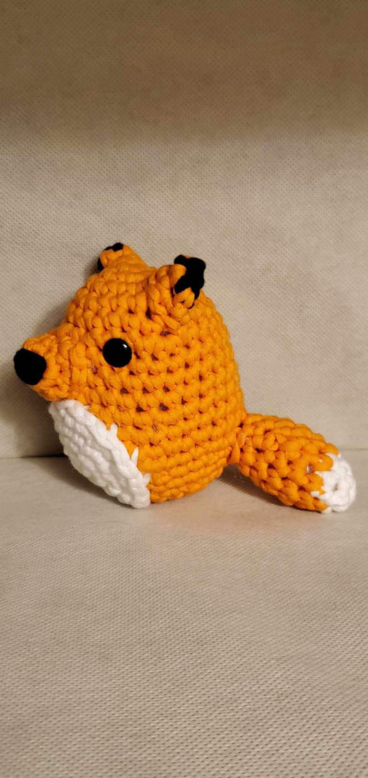 Handcrafted crocheted fox buddy named Copper. Orange and White with black tipped ears.