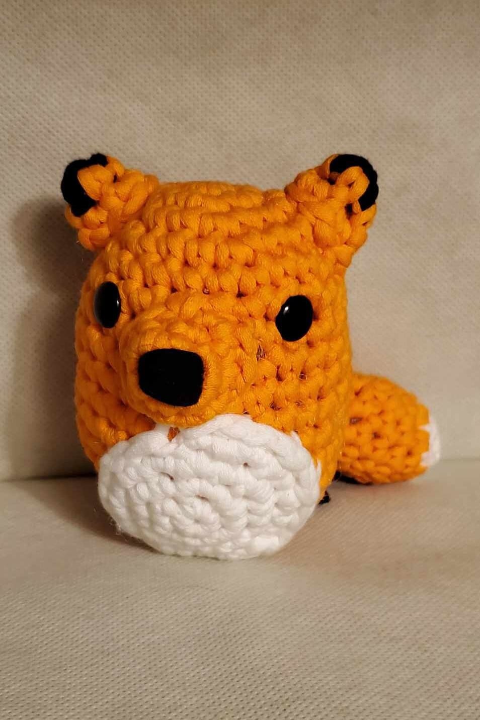 Handcrafted crocheted fox buddy named Copper. Orange and White with black tipped ears.